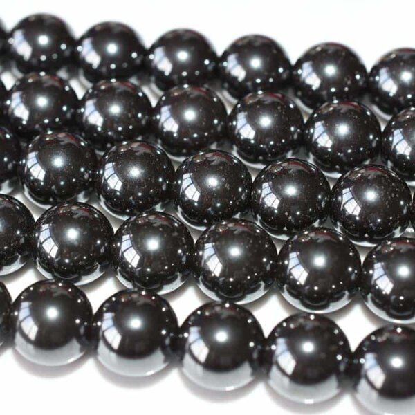 Loose Hematite Beads strands arranged diagonally, ideal for jewelry making