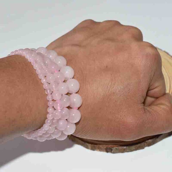 pink stone bracelet on hand