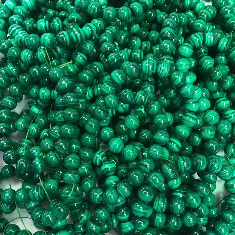 8mm Malachite beads bracelet highlighting rich green color and banded patterns, representing Malachite benefits for balance, transformation, and positive energy.
