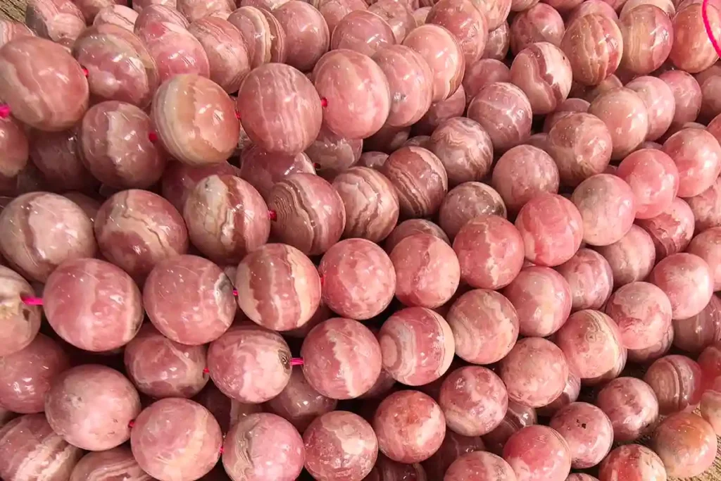 Rhodonite vs Rhodochrosite round beads – polished pink stones for bracelets and necklaces