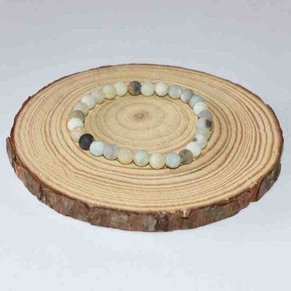 Matte Amazonite Bracelet displayed on wooden base – 6mm natural gemstone beads