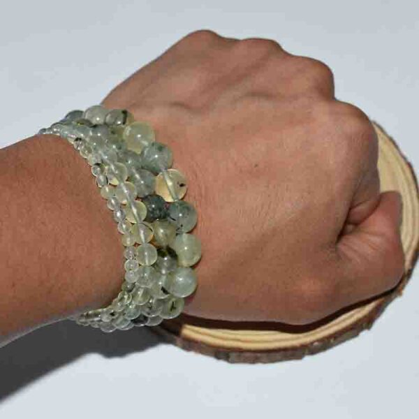 Wearing a Prehnite Bracelet for heart chakra healing