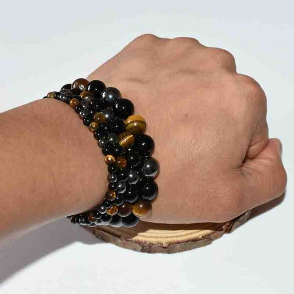 Model wearing crystal protection bracelet for emotional grounding