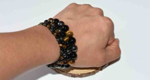 Model wearing crystal protection bracelet for emotional grounding