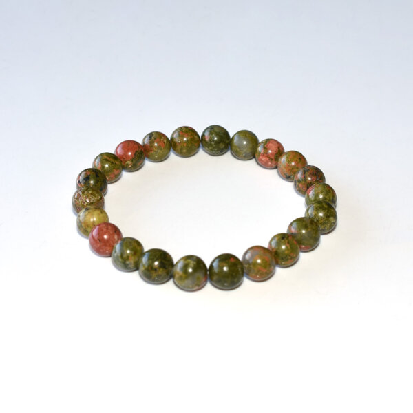 Single strand Unakite Bracelet with natural green and pink beads displayed on white background.