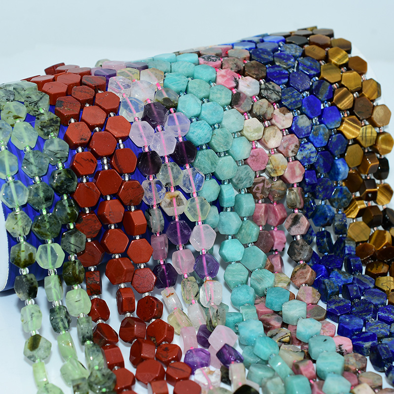 Hand holding 9x5mm hexagon beads for DIY jewelry making