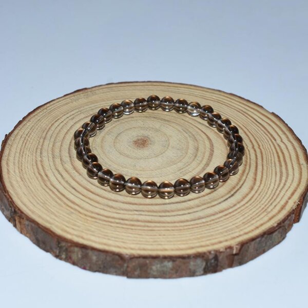 Smoky Quartz Bracelet displayed on wood tray for natural stone presentation