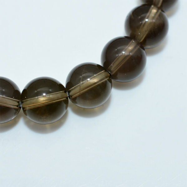 Close-up of Smoky Quartz beads showing translucent smoky texture