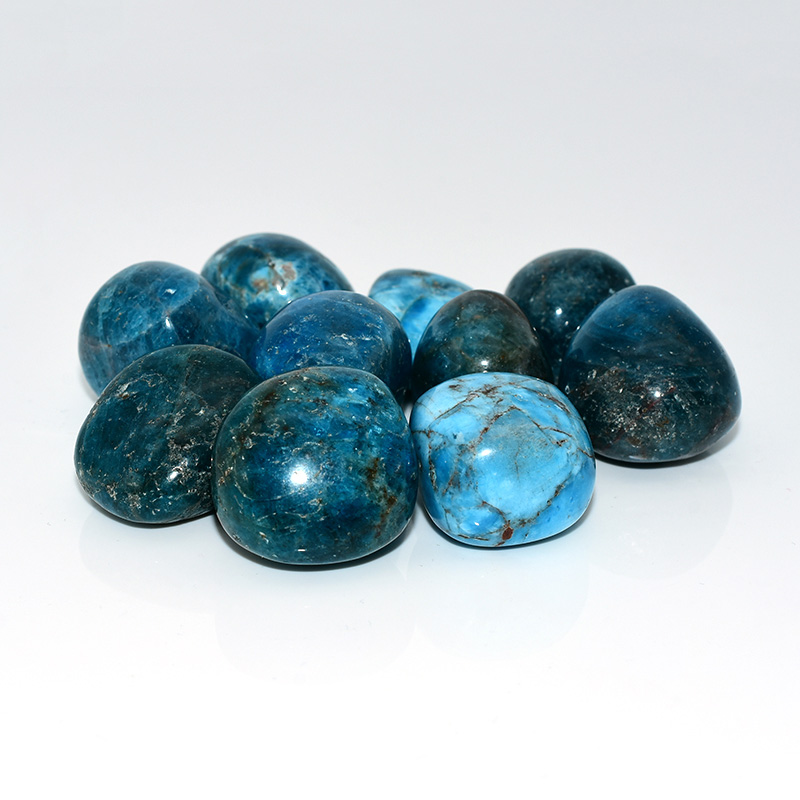 Natural blue apatite tumbled stones with varied patterns and textures