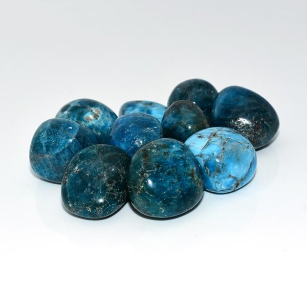 Shiny blue apatite stones arranged in a circular pattern