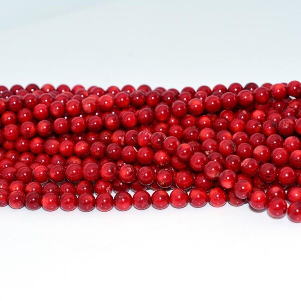 Close-up view of natural red coral beads for bracelets and necklaces