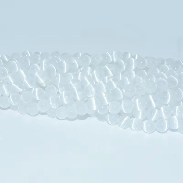 Natural selenite beads arranged in soft diagonal rows
