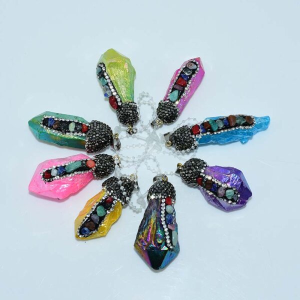 Assorted chakra quartz pendants arranged in a circle