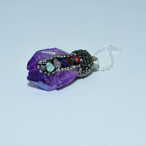 Purple crystal pendant featuring rhinestones and energy stones