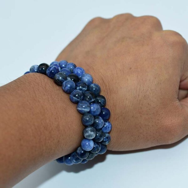 Wrist wearing Blue Sodalite Bracelet with round polished 10mm beads