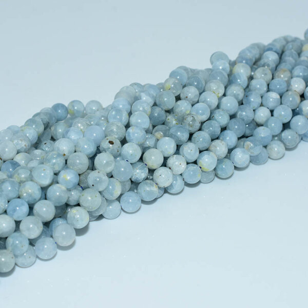 Celestite beads strand with natural sky blue tones, soft texture and mineral veins