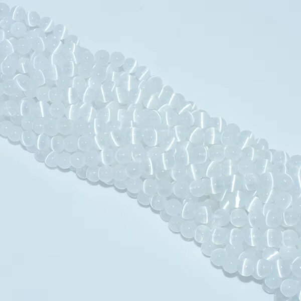 Layered white selenite beads displayed on a flat white background