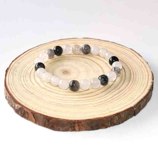 Artistic top view of Black Rutilated Quartz bracelet highlighting natural inclusions