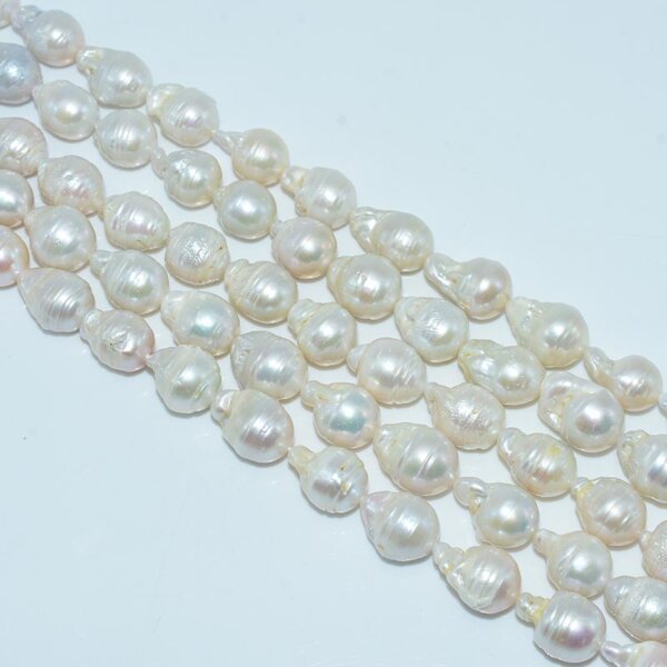 Close-up of aligned 13x18mm baroque pearl strands with natural luster