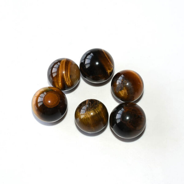 Six Tiger Eye Spheres on white background showing color variations