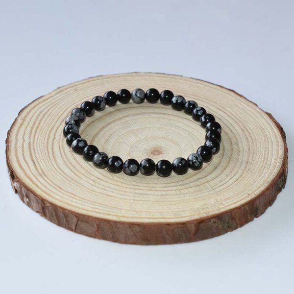 Minimalist Snowflake Obsidian bracelet with smaller round beads, perfect for subtle daily wear.