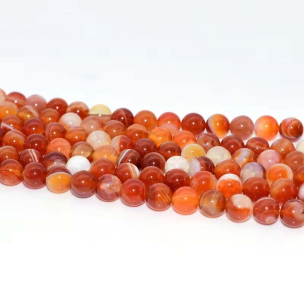 Red agate beads arranged in a row