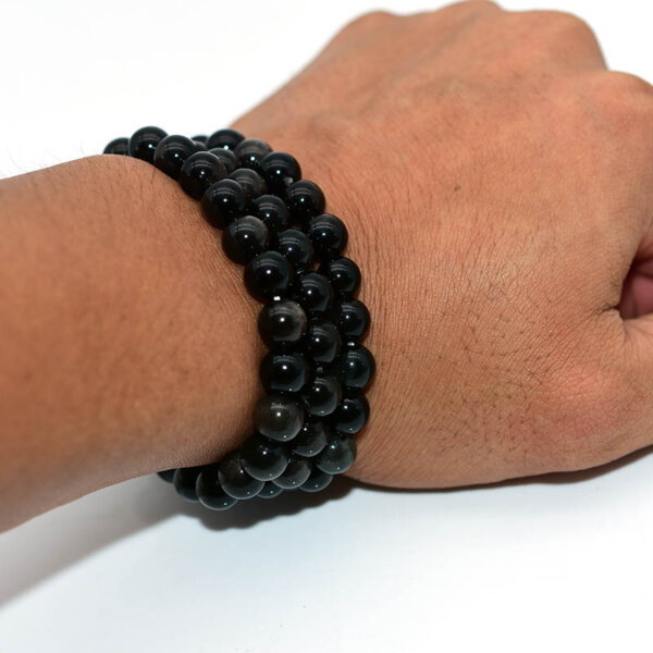 Side view of Silver Obsidian Bracelet on wrist, highlighting its thickness