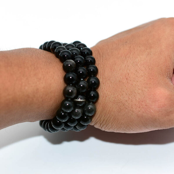 Close-up of Silver Obsidian Bracelet arranged in a circle on white background