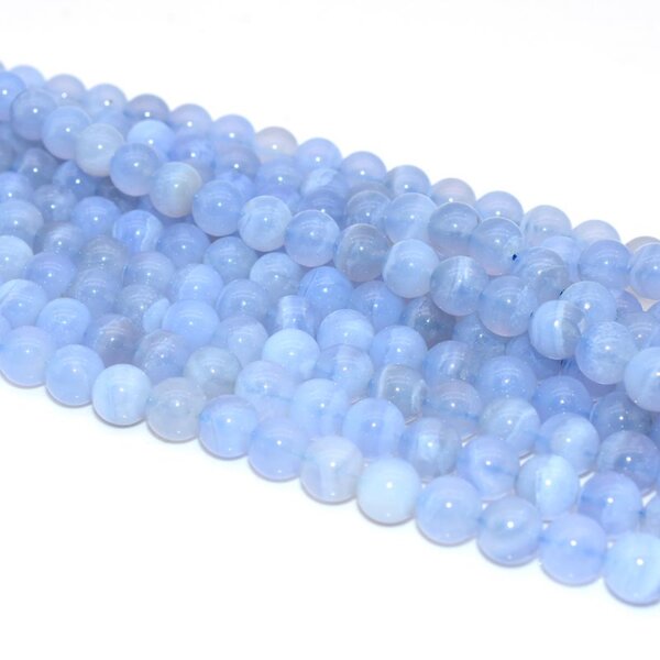 Pale Blue Lace Agate Beads neatly arranged in strands, 8mm smooth finish