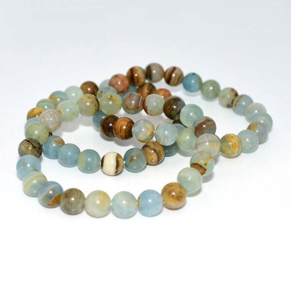 Single strand Blue Calcite Bracelet displayed in a circle on white background