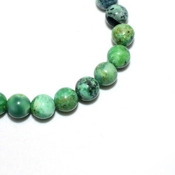 Close-up of Variscite beads – smooth polished surface with natural patterns