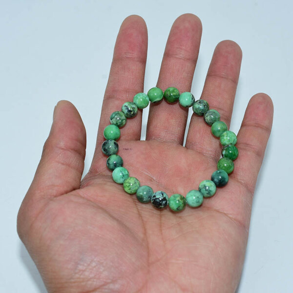 Variscite Bracelet shown on hand – soft green healing stone beads