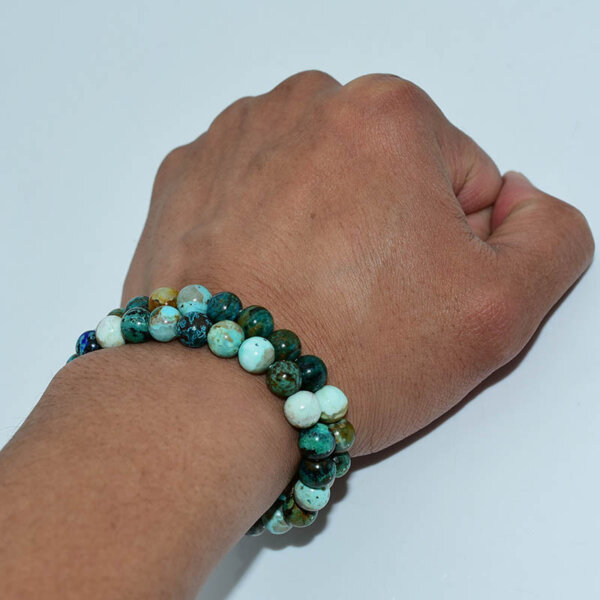 Close-up of Chrysocolla Bracelet on wrist, highlighting natural variations