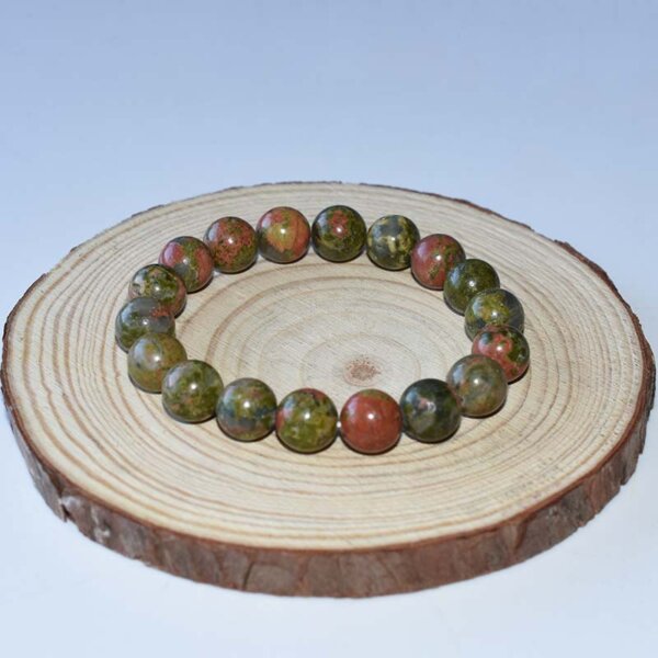 10mm Unakite Bracelet arranged in a circle, showing natural color variation in each bead.