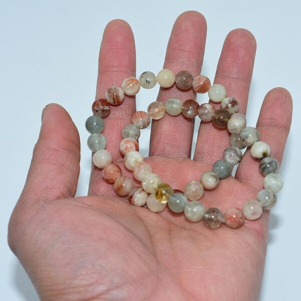 Arusha Sunstone Bracelet held in hand displaying earthy tones and texture
