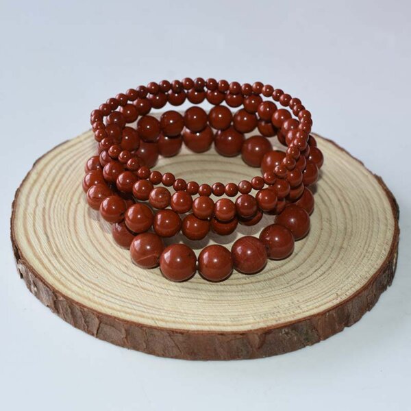 Coiled Red Jasper bracelet with multiple strands, highlighting bold earthy tone and grounding design.