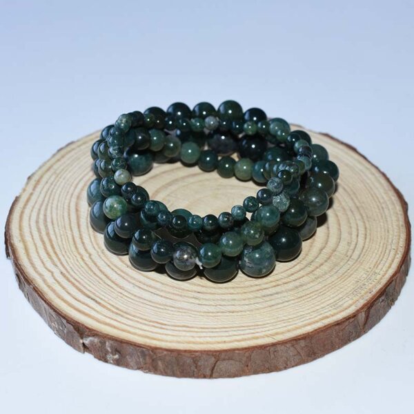 Triple-layer Moss Agate Bracelet on wood display – natural green stone