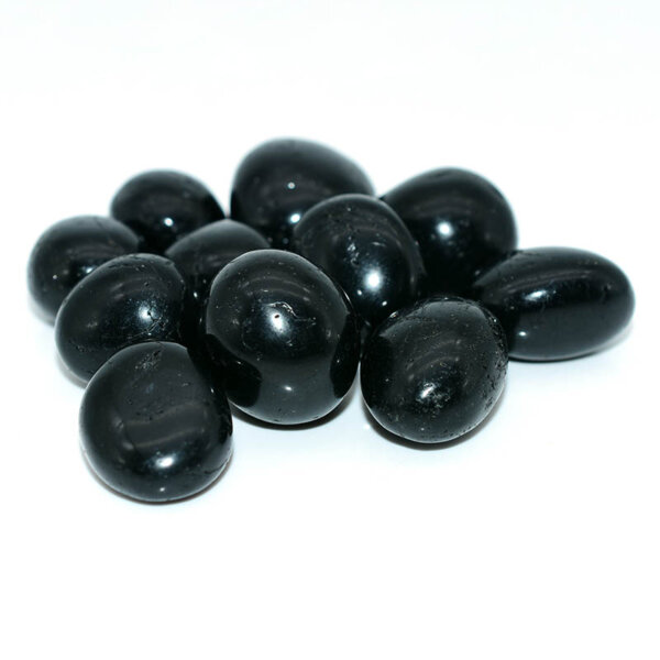 Black Tourmaline Tumbled stones 20–30mm – scattered view on white background