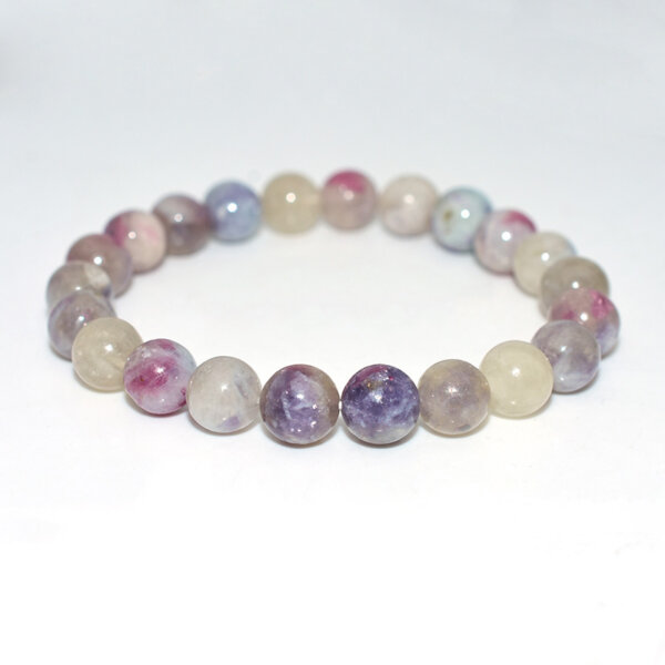 Pink Tourmaline Beaded Bracelet arranged in a circle on white background