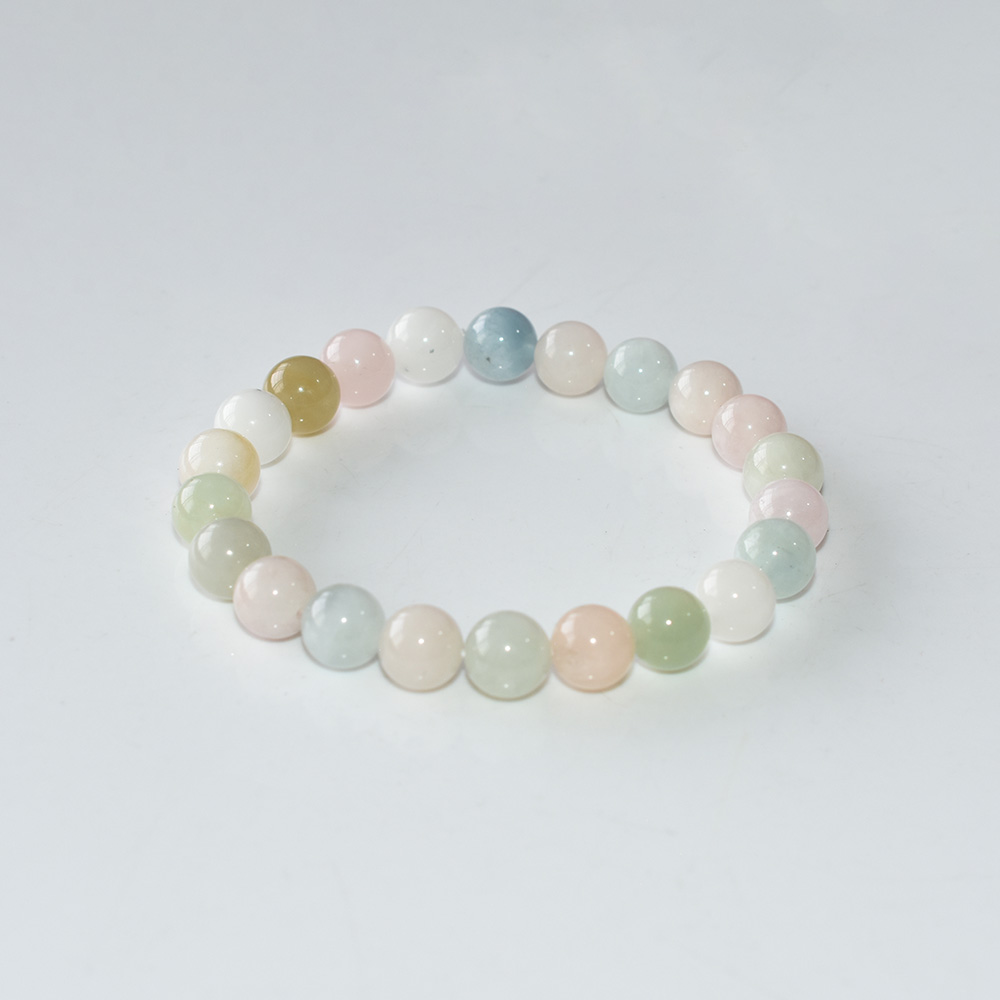 Morganite Crystal Bracelet with soft pink and green natural beads on white background, 8mm round stones, handmade stretch design