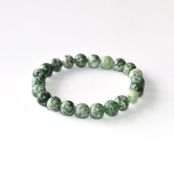 Green Spot Jasper bracelet with round beads on white background
