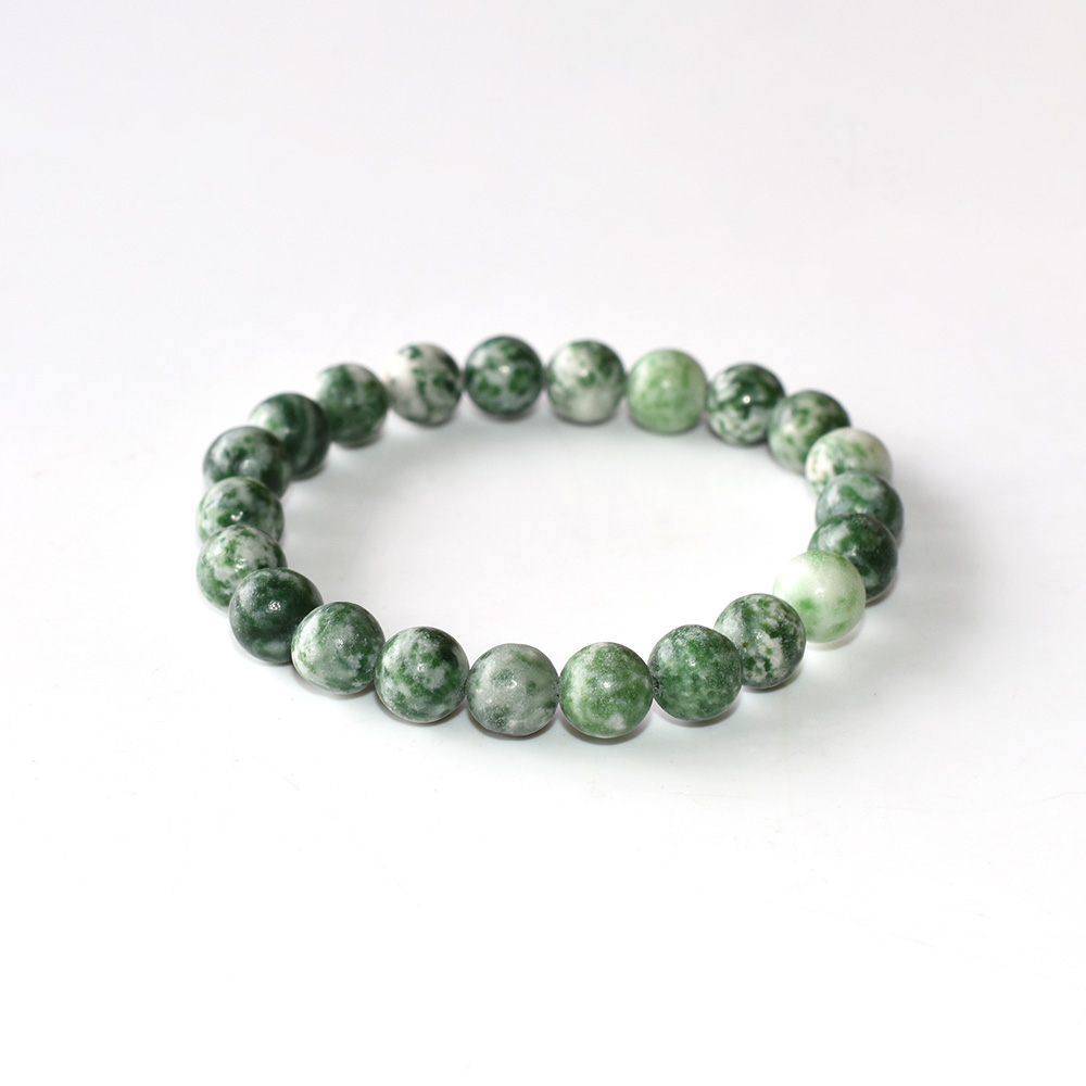Green Spot Jasper bracelet with round beads on white background