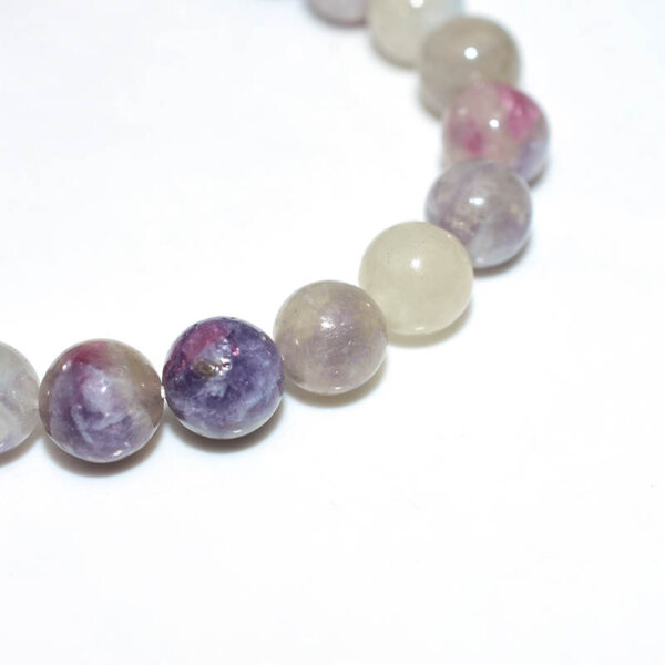 Close-up of Pink Tourmaline beads showing natural color variations
