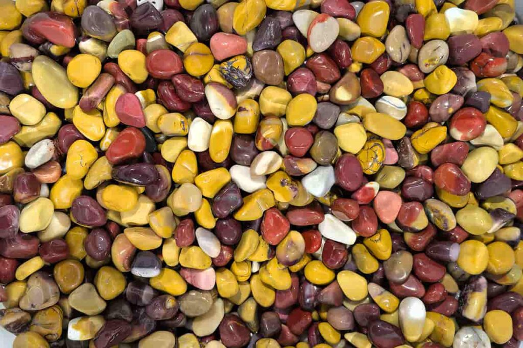 Mookaite Jasper Meaning – Mookaite Jasper chip stones in mixed red, yellow, and brown colors