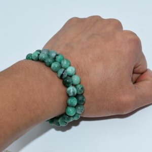 Emerald bracelet worn on wrist, showcasing vivid green tones