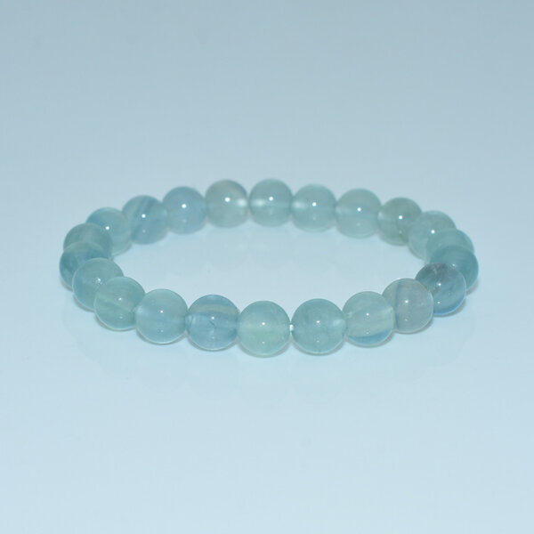 Blue Fluorite Bracelet with round polished beads on white background