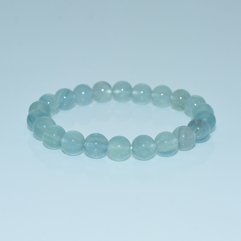 Blue Fluorite Bracelet with round polished beads on white background