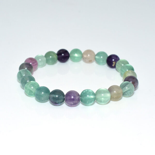 Fluorite crystal bracelet laid flat with multi-colored semi-transparent beads