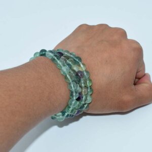 Fluorite crystal bracelet wrapped around wrist for scale and fit reference