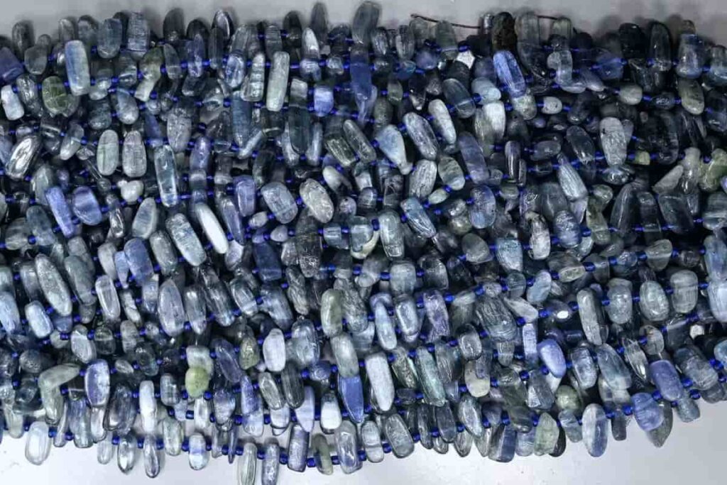 Blue Kyanite Meaning — polished kyanite strand beads for jewelry making, symbolizing tranquility and self-expression.